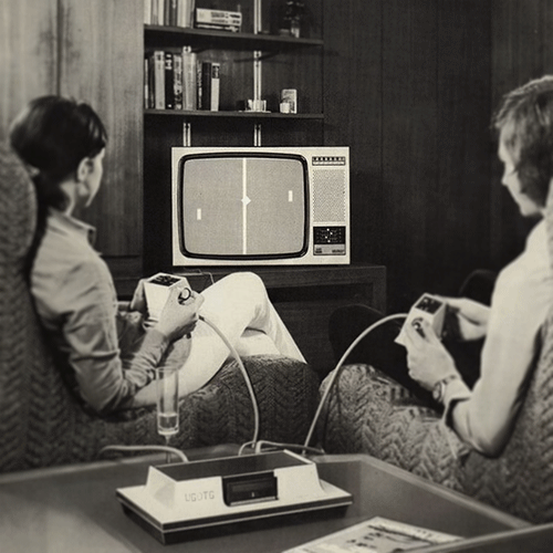 Kids in 70's livingroom playing Pong
